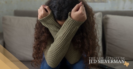 Sad woman crossing her arms over her face