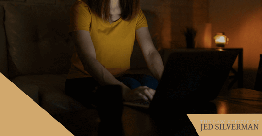 woman on computer at night