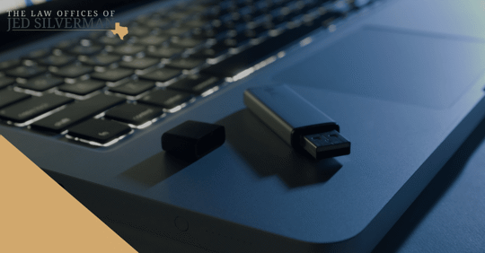 flashdrive on laptop in the dark