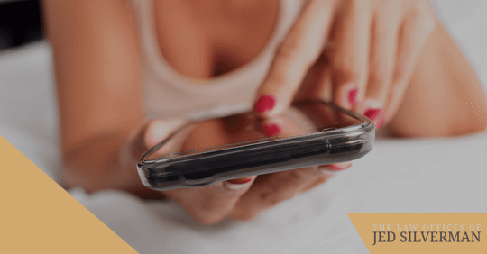 woman texting in bed