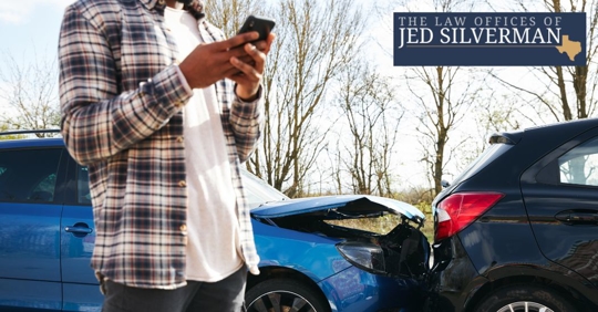 man trying to contact someone after a car accident